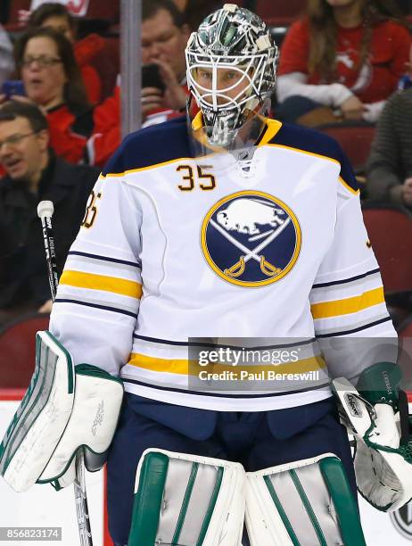 Goaltender Anders Lindback of the Buffalo Sabres warms up prior to a game against the New Jersey Devils at Prudential Center on February 17, 2015 in...