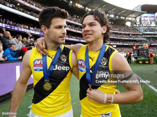 Trent Cotchin of the Tigers celebrates with Daniel Rioli of the Tigers during the 2017 Toyota AFL Grand Final match between the Adelaide Crows and...