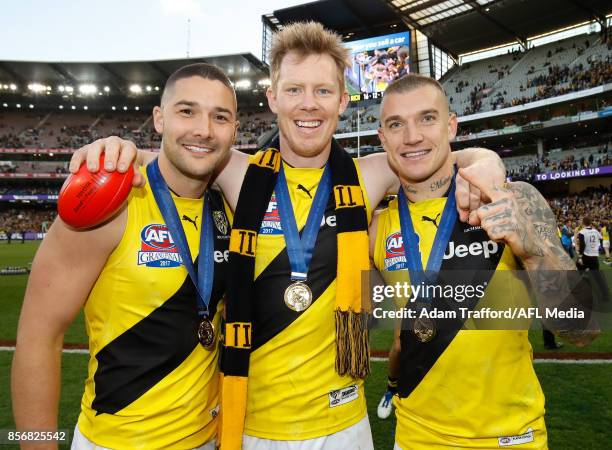 Shaun Grigg, Jack Riewoldt and Dustin Martin of the Tigers celebrate during the 2017 Toyota AFL Grand Final match between the Adelaide Crows and the...