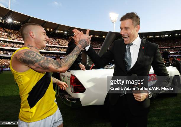 Dustin Martin of the Tigers celebrates with Tigers legend Matthew Richardson during the 2017 Toyota AFL Grand Final match between the Adelaide Crows...