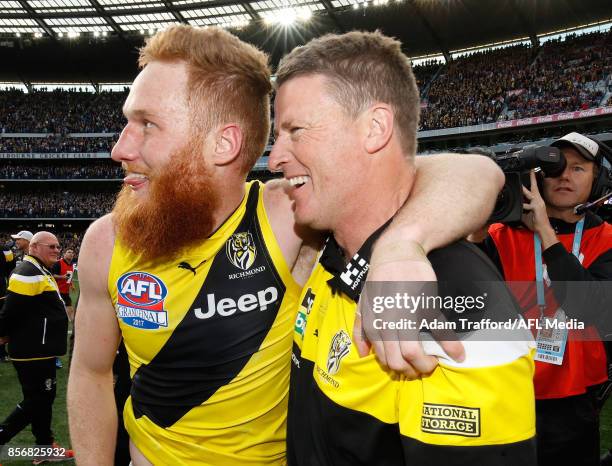 Damien Hardwick, Senior Coach of the Tigers celebrates with Nick Vlastuin of the Tigers during the 2017 Toyota AFL Grand Final match between the...