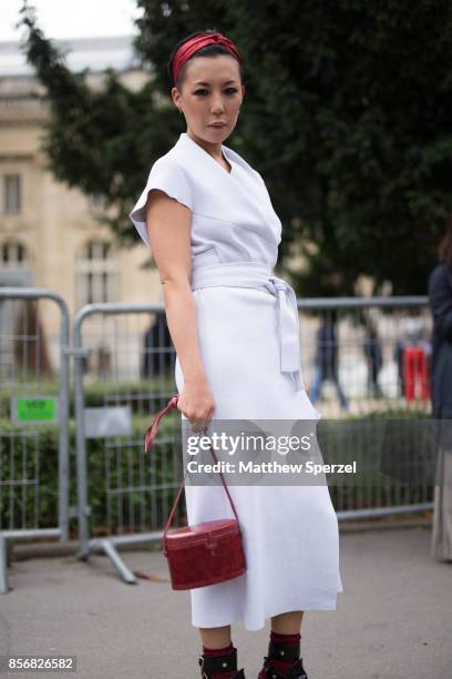 Jeannie Lee is seen attending Sacai during Paris Fashion Week wearing Proenza Schouler and Hunting Season on October 2, 2017 in Paris, France.