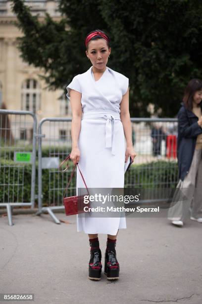 Jeannie Lee is seen attending Sacai during Paris Fashion Week wearing Proenza Schouler and Hunting Season on October 2, 2017 in Paris, France.