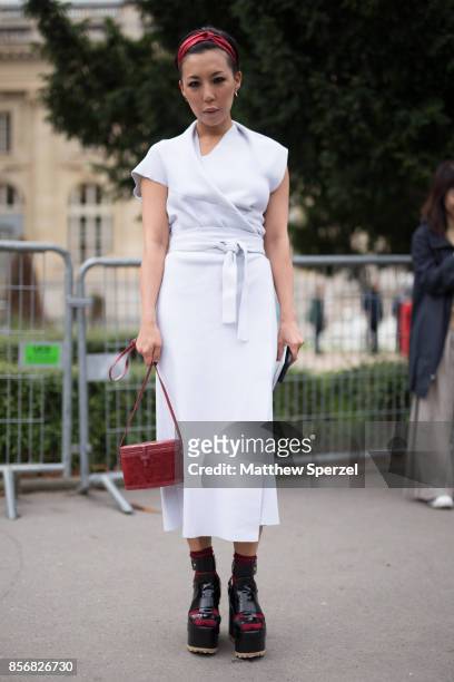 Jeannie Lee is seen attending Sacai during Paris Fashion Week wearing Proenza Schouler and Hunting Season on October 2, 2017 in Paris, France.