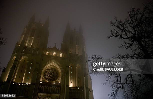 The Washington National Cathedral is shown with its lights on just prior to turning the main exterior lights off to mark the World Wildlife Fund's...