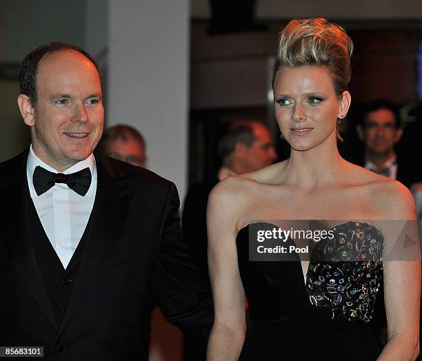 Prince Albert II of Monaco and Charlene Wittstock arrive at the 2009 Monte Carlo Rock' N Rose Ball held at The Sporting Monte Carlo on March 28, 2009...