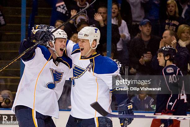 Brad Winchester and KeithTkachuk both of the St. Louis Blues celebrate Tkachuk's goal against the Columbus Bluejackets at the Scottrade Center on...