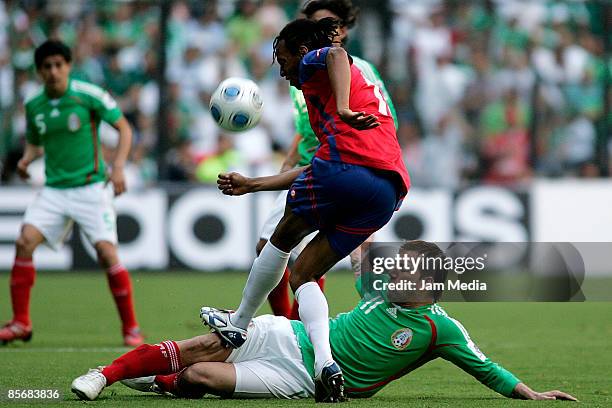 Mexico player Matias Vuoso and Junior Diaz of Costa Rica fight for the ball during their FIFA 2010 World Cup Qualifying match at the Azteca Stadium...