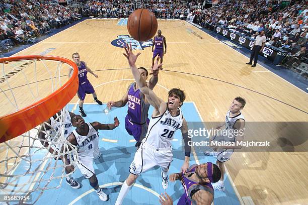 Kyle Korver of the Utah Jazz goes up for the shot against the Phoenix Suns at EnergySolutions Arena on March 28, 2009 in Salt Lake City, Utah. NOTE...
