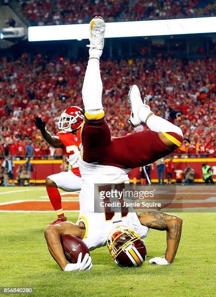 Wide receiver Terrelle Pryor of the Washington Redskins catches a pass in the end zone for a touchdown as cornerback Marcus Peters of the Kansas City...