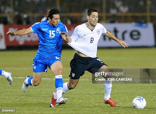 Salvadorean Alfredo Pacheco vies the ball with US Clinton Dempsey at the Cuscatlan stadium on March 28 in San Salvador during their FIFA World Cup...