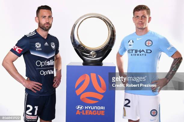 Carl Valeri of Malbourne Victory and Michael Jakobsen of Melbourne City pose during the 2017/18 A-League Season Launch at Port Melbourne SC on...