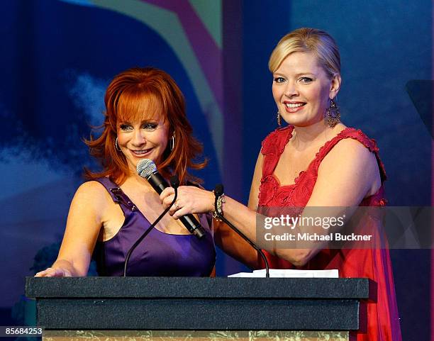 Singer Reba McEntire and actress Melissa Peterman onstage during Muhammad Ali's Celebrity Fight Night XV held at the JW Marriott Desert Ridge Resort...