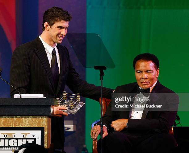 Olympis swimmer Michael Phelps and Muhammad Ali speak on stage during Muhammad Ali's Celebrity Fight Night XV held at the JW Marriott Desert Ridge...