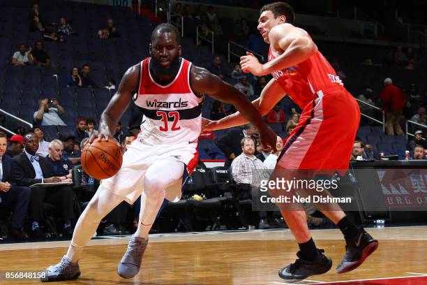 Daniel Ochefu of the Washington Wizards handles the ball during the preseason game against the Guangzhou Long-Lions on October 2, 2017 at Capital One...