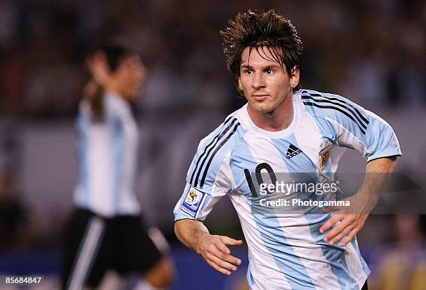 Lionel Messi of Argentina celebrates the first goal during the 2010 FIFA World Cup South African qualifier match between Argentina and Venezuela at...