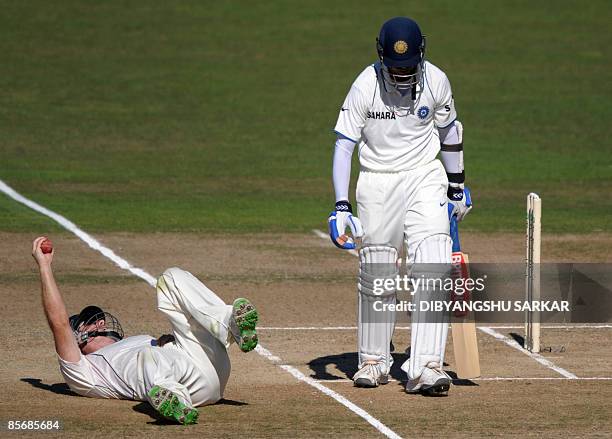 New Zealand cricketer Jamie How celebrates the wicket of Indian batsman Rahul Dravid during the fourth day of the second Test match between New...