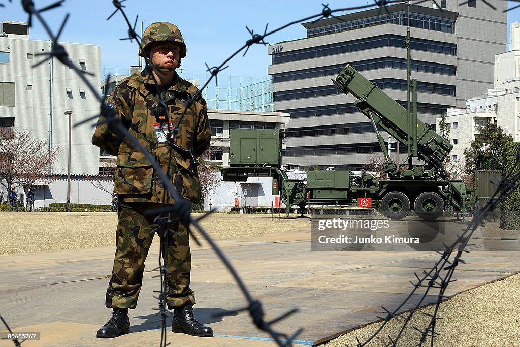 Jgsdf Riots A member of Japan Ground Self-Defense Force stands guard in front of ...