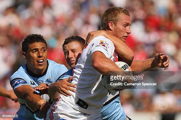 Matt Prior of the Dragons is tackled during the round three NRL match between the St George Illawarra Dragons and the Cronulla Sharks at WIN Jubilee...