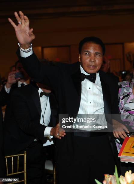 Muhammad Ali waves to fans during Muhammad Ali's Celebrity Fight Night XV held at the JW Marriott Desert Ridge Resort & Spa on March 28, 2009 in...