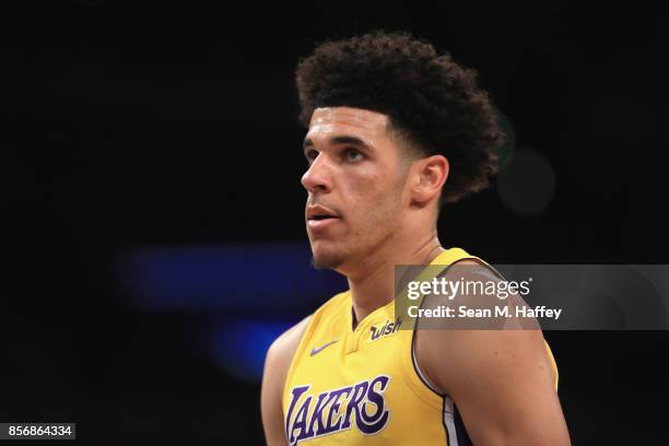 Lonzo Ball of the Los Angeles Lakers looks on during the first half of a preseason game against the Denver Nuggets at Staples Center on October 2,...