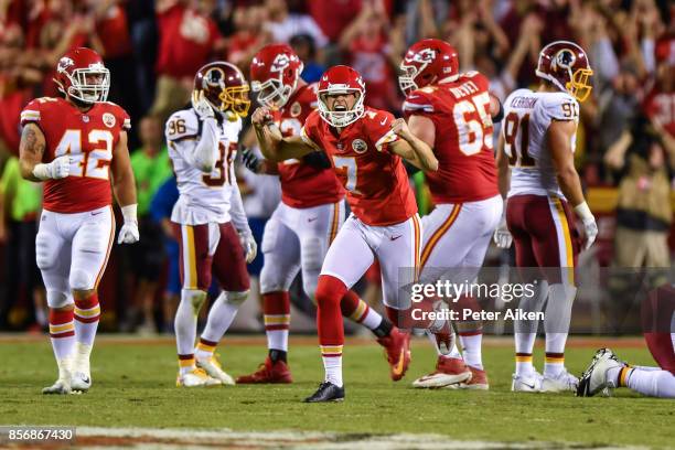 Kicker Harrison Butker of the Kansas City Chiefs turns and celebrates after kicking the go ahead field goal with eight seconds left during the game...