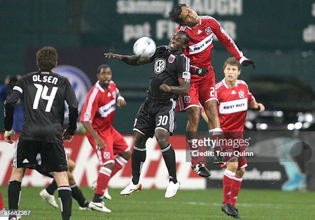 Francis Doe of D.C. United challenges Wilman Conde of the Chicago Fire for the ball during an MLS match at RFK Stadium on March 28, 2009 in...