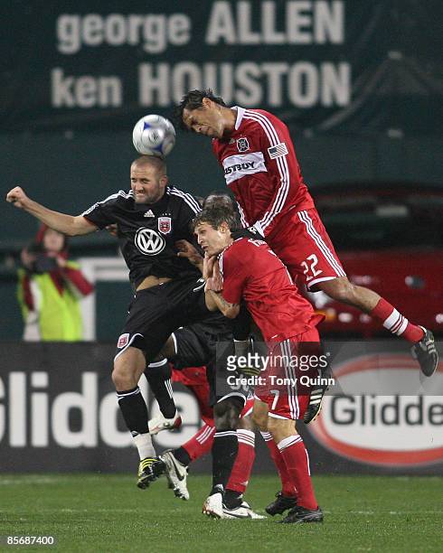 Brandon Barklage of D.C. United goes for a header withWilman Conde of the Chicago Fire during an MLS match at RFK Stadium on March 28, 2009 in...