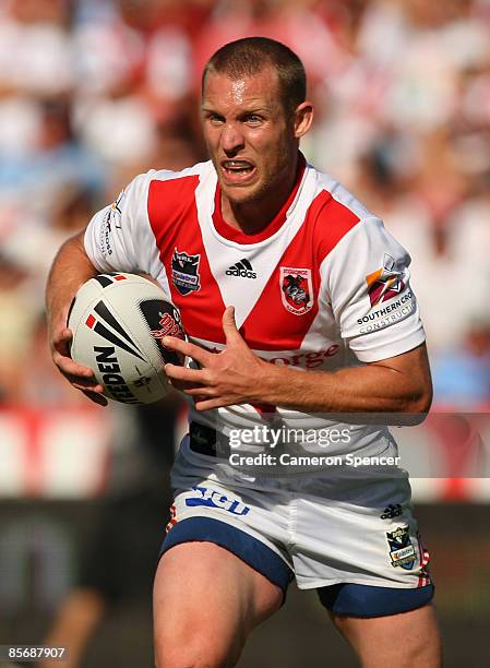 Ben Hornby of the Dragons runs the ball during the round three NRL match between the St George Illawarra Dragons and the Cronulla Sharks at WIN...