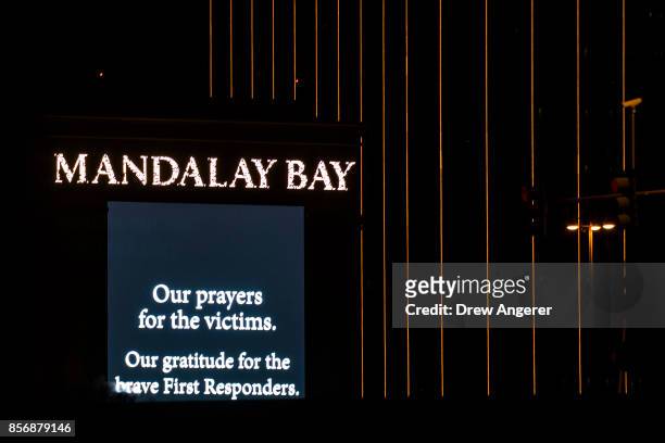 Condolence message is displayed on signage from the Mandalay Bay Resort and Casino, October 2, 2017 in Las Vegas, Nevada. Late Monday night, a lone...