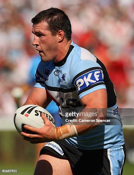 Paul Gallen of the Sharks runs the ball during the round three NRL match between the St George Illawarra Dragons and the Cronulla Sharks at WIN...