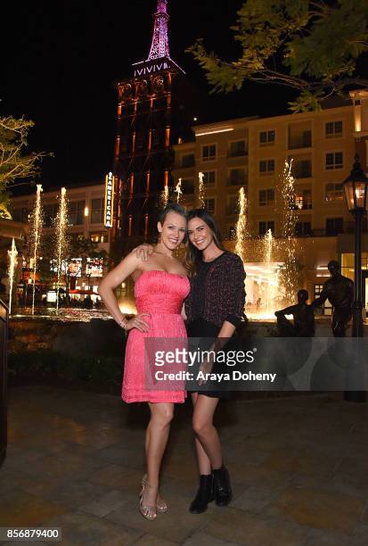 Erin Cummings and Odette Annable "Go Pink" to light The Americana at Brand's spire support Breast Cancer Awareness Month and the American Cancer...