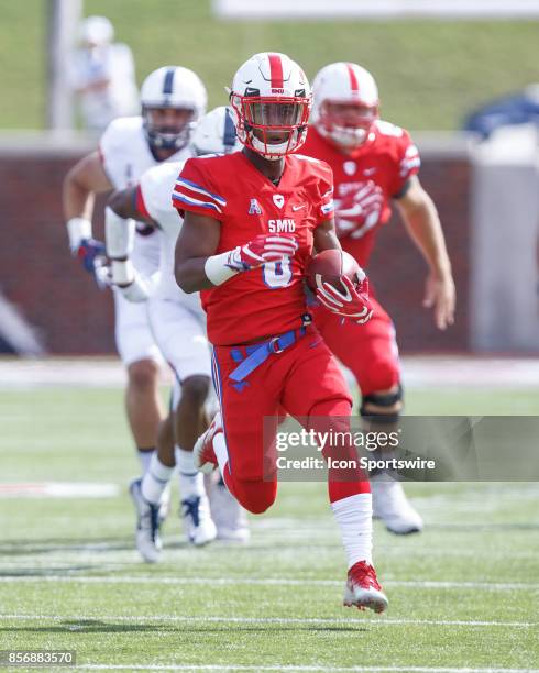 Mustangs running back Braeden West runs up field during the college football game between the SMU Mustangs and the UConn Huskies on September 30,...