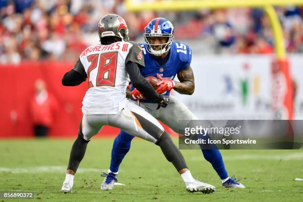 New York Giants wide receiver Brandon Marshall looks to dodge Tampa Bay Buccaneers cornerback Vernon Hargreaves III during an NFL football game...