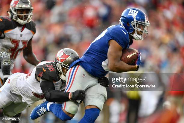 New York Giants wide receiver Sterling Shepard is tackled by Tampa Bay Buccaneers cornerback Robert McClain after a reception during an NFL football...