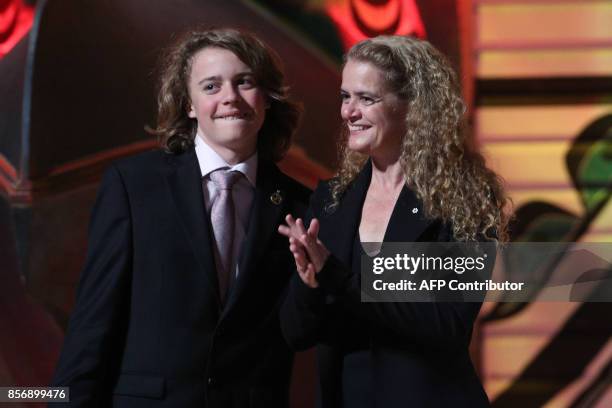 Governor General Julie Payette receives a hug from her son Laurier Payette Flynn during a reception at the Canadian Museum of History in Gatineau,...