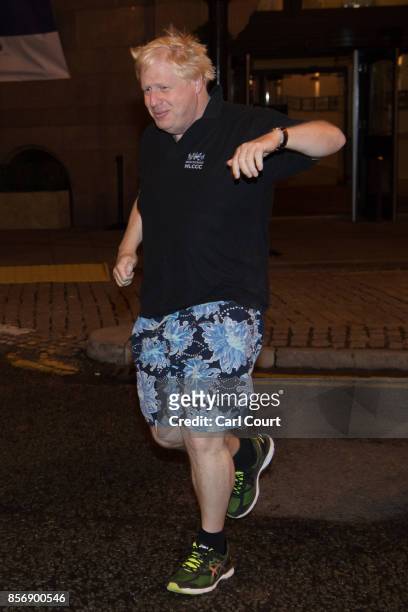 Foreign Secretary Boris Johnson goes for a morning jog on day three of the annual Conservative Party conference on October 3, 2017 in Manchester,...