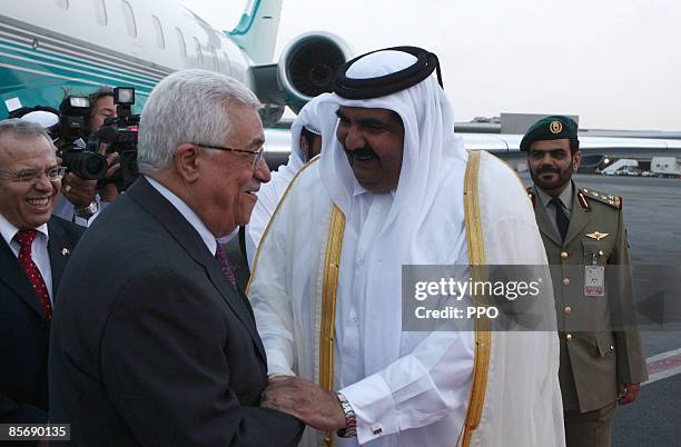 In this handout image provided by the Palestinian Press Office , Palestianian president Mahmoud Abbas is received on his arrival by the emir of...