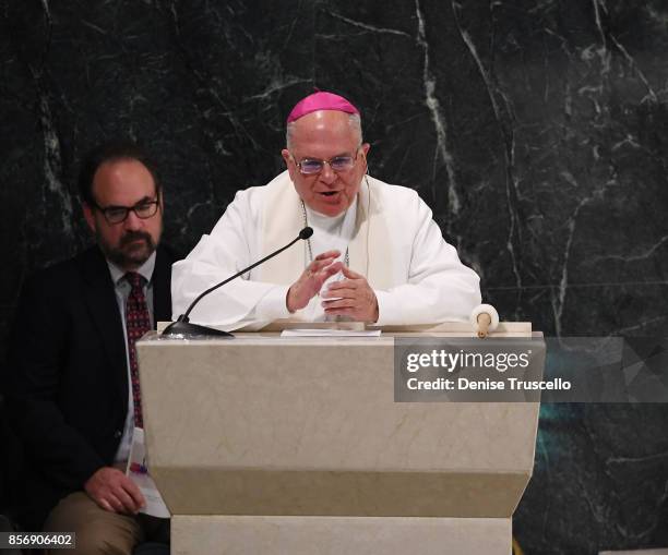 Bishop Joseph A. Pepe speaks during a vigil at Guardian Angel Cathedral, for the victims of the Route 91 Harvest country music festival shootings on...