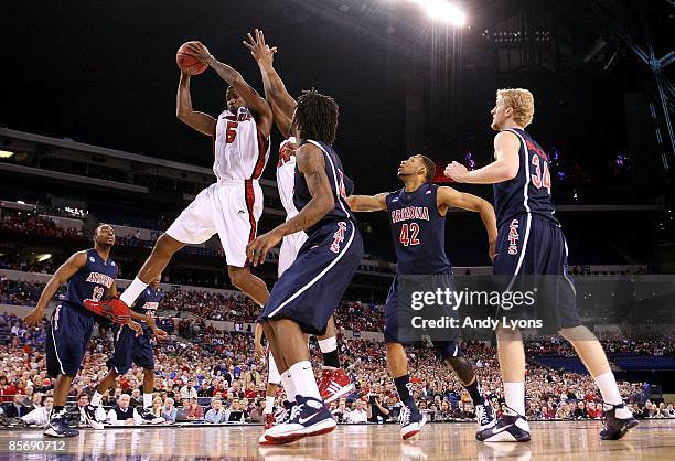 Earl Clark of the Louisville Cardinals controls a rebound against the Arizona Wildcats during the third round of the NCAA Division I Men's Basketball...