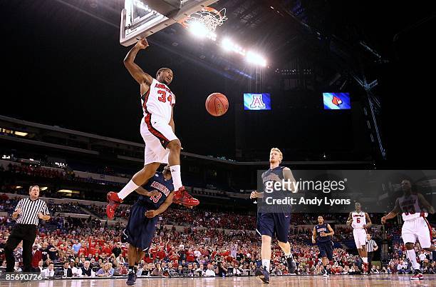 Jerry Smith of the Louisville Cardinals dunks against the Arizona Wildcats during the third round of the NCAA Division I Men's Basketball Tournament...