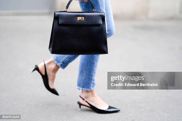 Guest wears a hermes bag, outside Giambattista Valli, during Paris Fashion Week Womenswear Spring/Summer 2018, on October 2, 2017 in Paris, France.