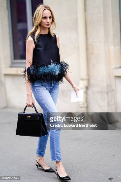 Guest wears a hermes bag, outside Giambattista Valli, during Paris Fashion Week Womenswear Spring/Summer 2018, on October 2, 2017 in Paris, France.