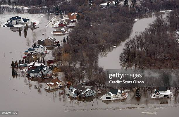 Homes are flooded by water from the Red River March 29, 2009 in Fargo, North Dakota. As flood waters from the Red River began to recede in Fargo and...