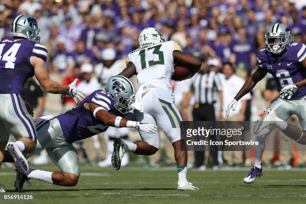 Baylor Bears wide receiver Tony Nicholson is tackled by Kansas State Wildcats defensive back Kendall Adams after a catch in the first half of a Big...