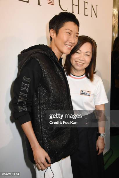 Designer Wang Chen Tsai-Hsia from Schiatzy Chen and a guest attend the Schiatzy Chen show as part of the Paris Fashion Week Womenswear Spring/Summer...