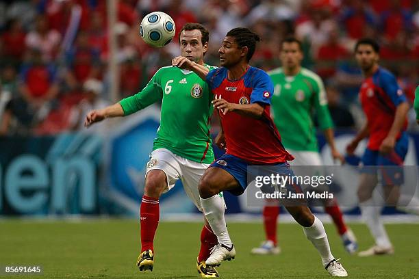 Gerardo Torrado of Mexico and Michael Barrantes of Costa Rica fights for the ball during their FIFA 2010 World Cup Qualifying match at the Azteca...