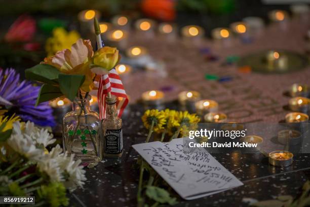 Detail of a makeshift memorial at the Tom Petty and the Heartbreakers star on The Hollywood Walk of Fame on October 2, 2017 in Los Angeles,...