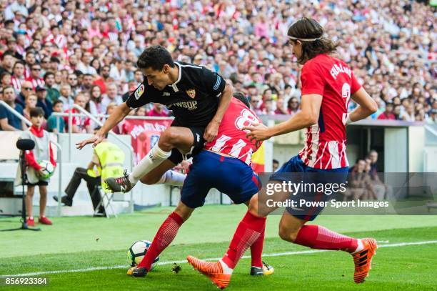 Daniel Filipe Martins Carrico of Sevilla FC fights for the ball with Saul Niguez Esclapez of Atletico de Madrid during the La Liga 2017-18 match...