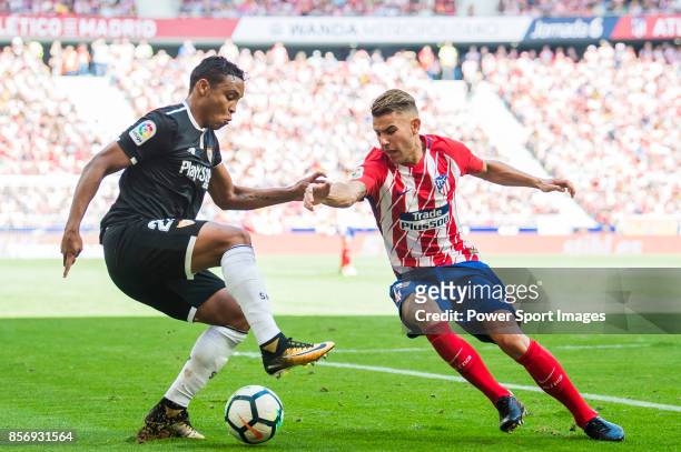 Luis Muriel of Sevilla FC fights for the ball with Lucas Hernandez of Atletico de Madrid during the La Liga 2017-18 match between Atletico de Madrid...